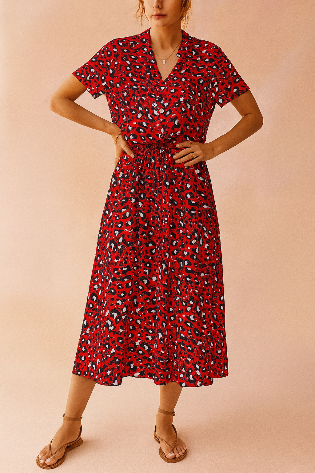 Vacation-ready women's polka dot midi dress. Boho style with a flattering tie-waist for summer elegance.