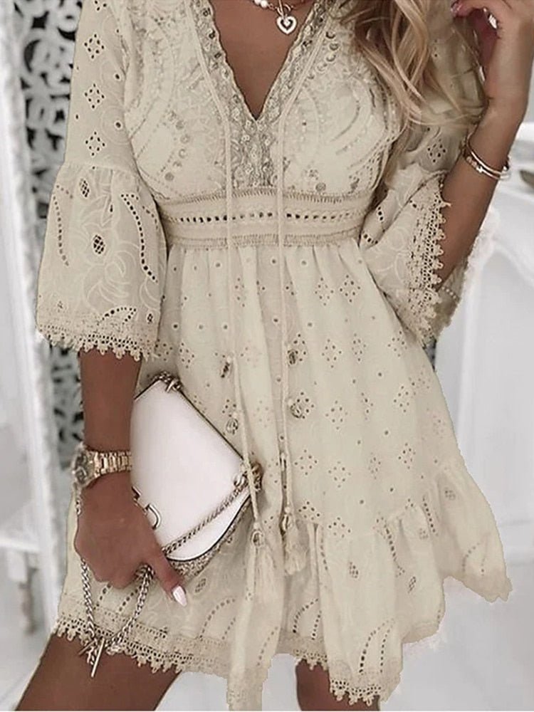Women's boho mini dress with V-neck, flowy bell sleeves & A-line cut. Perfect for summer, vacation, or festival.