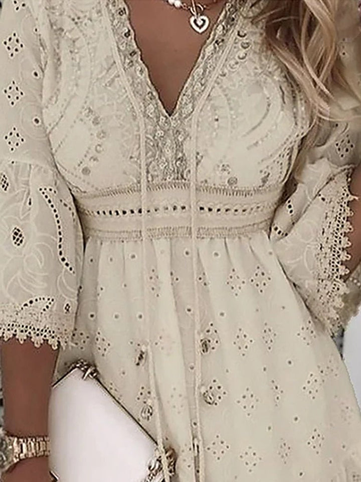 Bohemian lace mini dress with V-neck & bell sleeves. Ideal casual elegance for spring, beachwear, or date night.