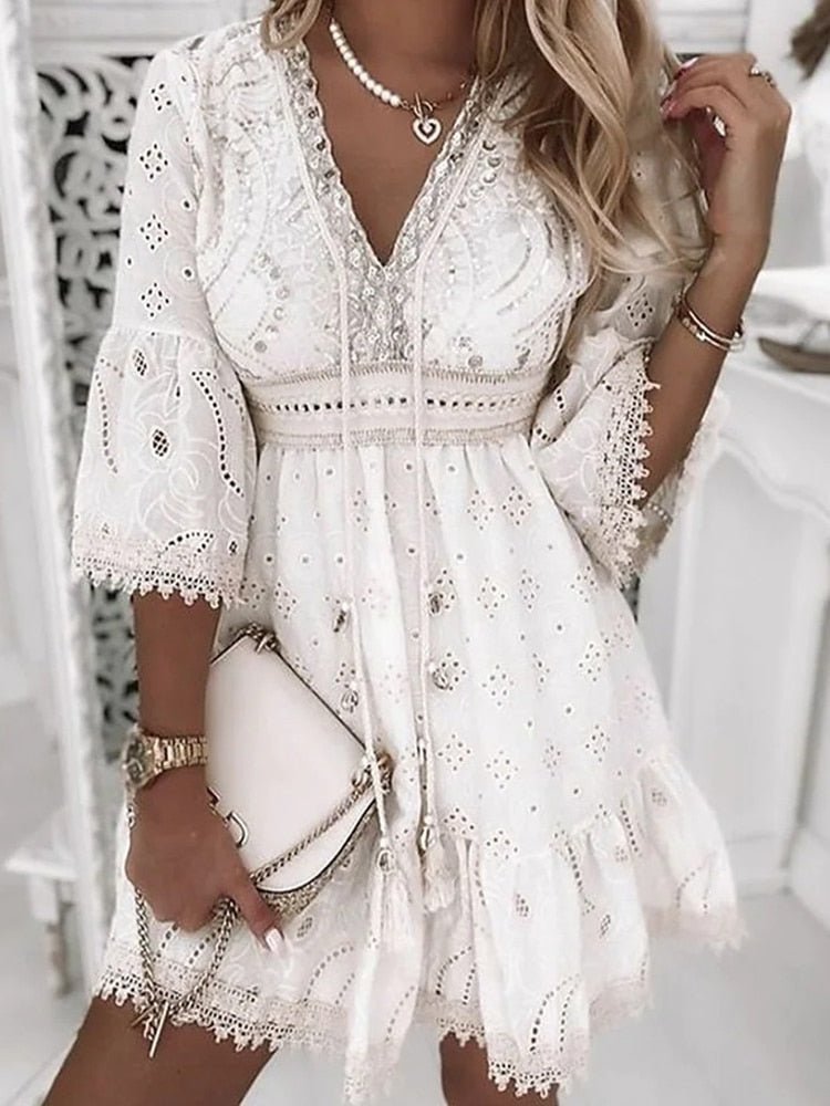 Stylish women's boho mini dress with V-neck & bell sleeves. A-line design, perfect spring/summer fashion & beachwear.