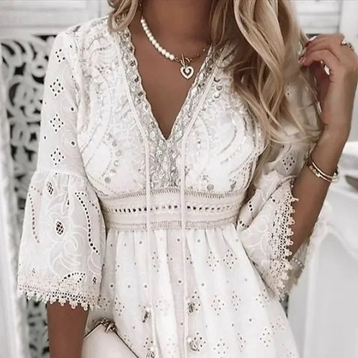 Women's V-neck boho mini dress with elegant bell sleeves & A-line silhouette. Ideal for summer parties & festivals.