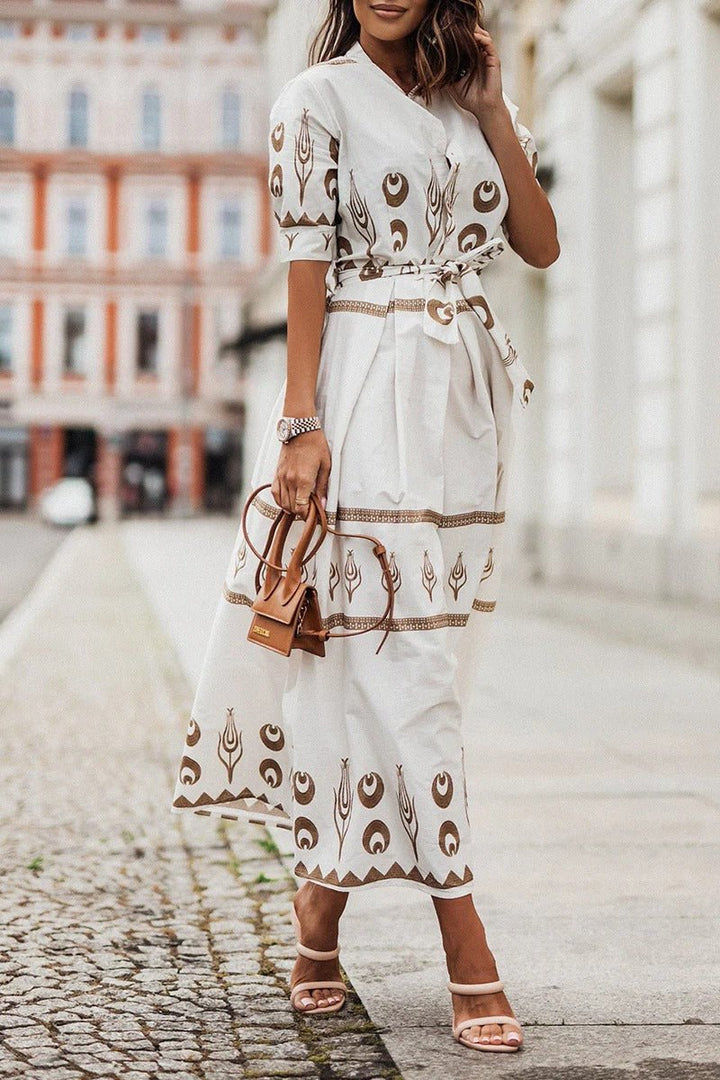 Black boho print midi dress with 3/4 sleeves & self-tie waist, ideal for chic day or evening wear.