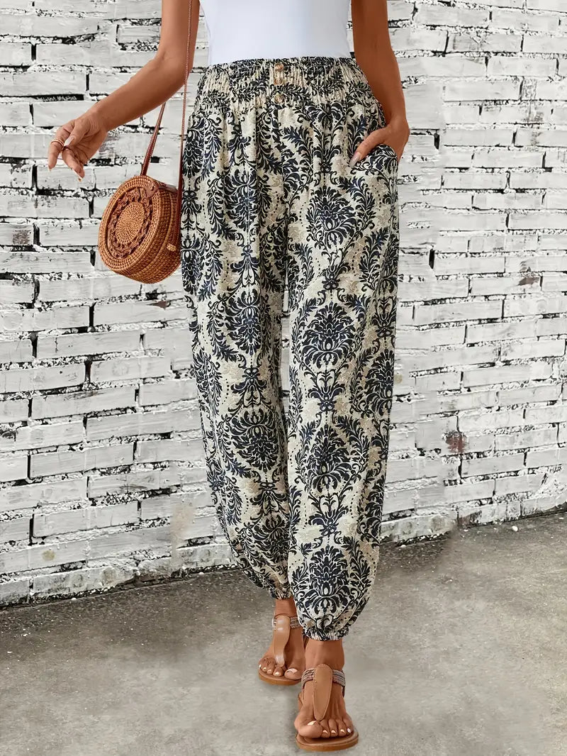 Vibrant boho print wide leg trousers for women, featuring a relaxed fit & elastic waist, great for summer style.