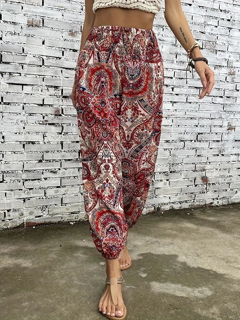 Flowy women's boho print wide leg pants, an elastic waist statement piece for comfortable spring & summer fashion.