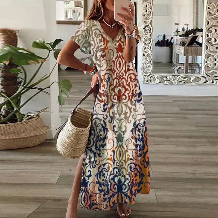 Women's boho printed maxi dress with vibrant pattern, ideal for summer beach days & casual vacation wear. Flowy & comfortable.