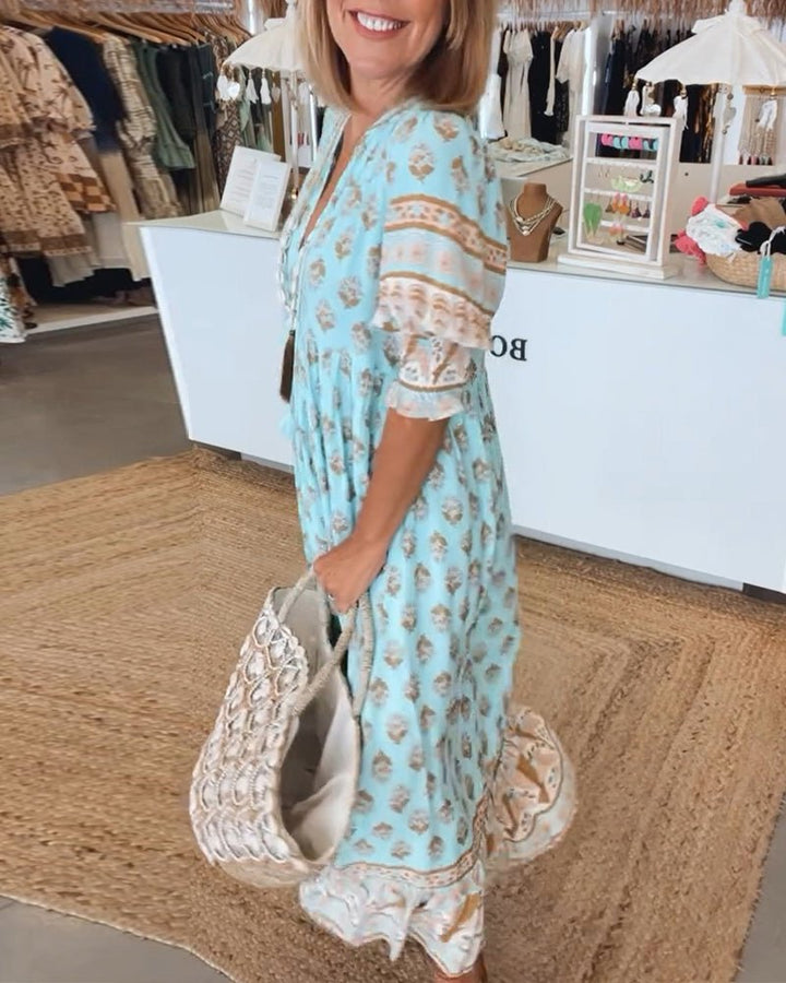 Vacation-ready women's printed midi dress with boho style & tassel ties, ideal for summer fashion.