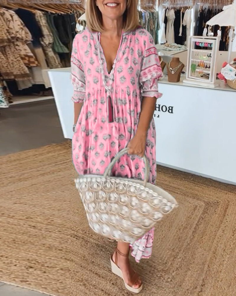Stylish women's boho printed midi dress, perfect for warm weather, featuring a relaxed fit & tassel tie.