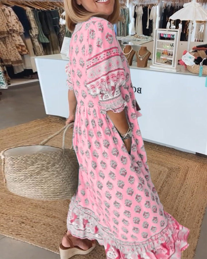 Bohemian chic printed midi dress for women, with a flattering flowy silhouette and charming tassel tie.