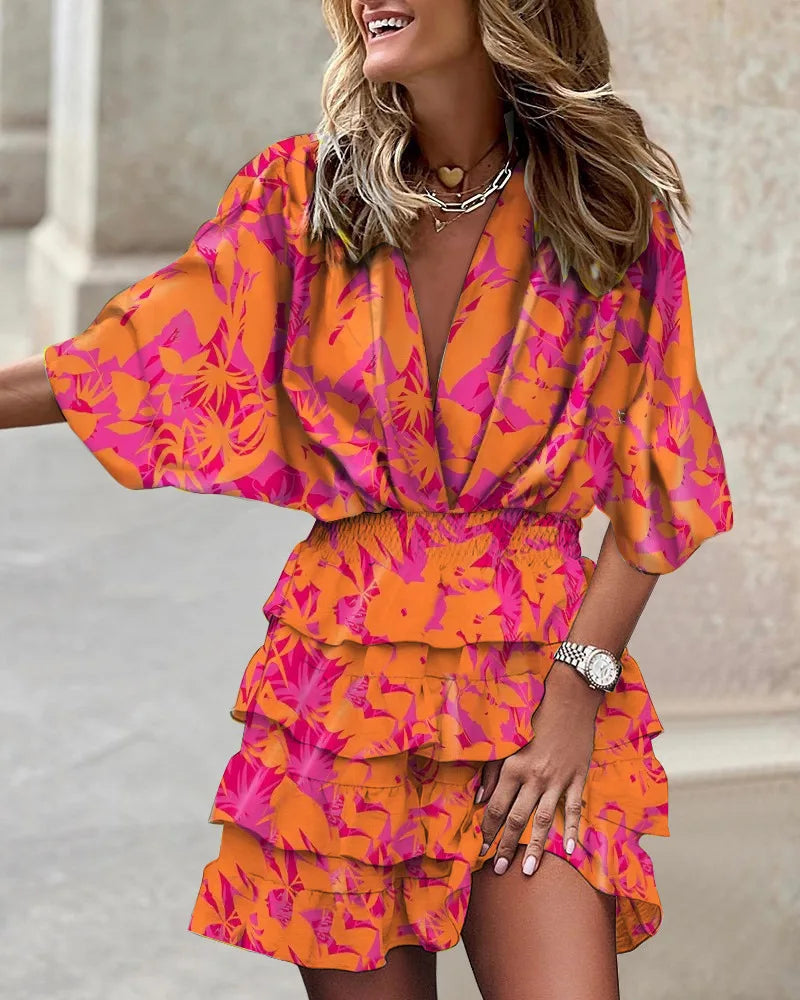Comfortable & feminine women's boho printed mini dress with ruffles, offering a flowy fit for summer fashion.