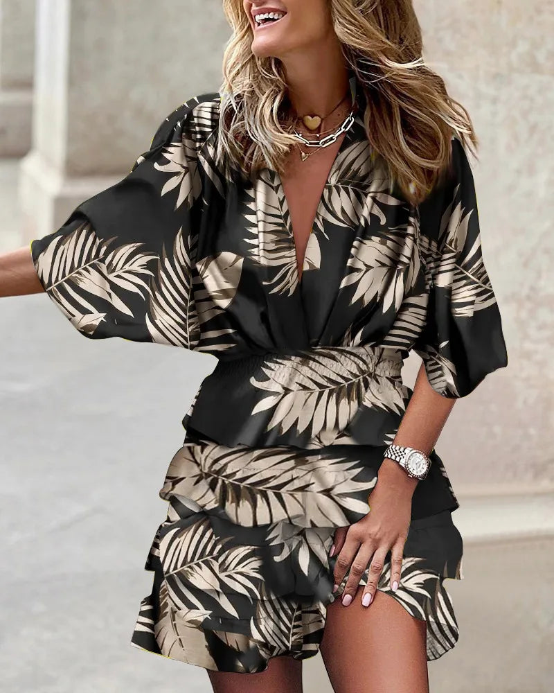 Chic flowy boho mini dress for women, featuring a beautiful print and ruffle details, perfect for summer style.