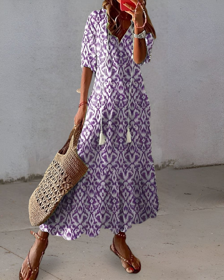 Elegant printed boho maxi dress for women, featuring a flattering v-neck, great for any summer occasion.
