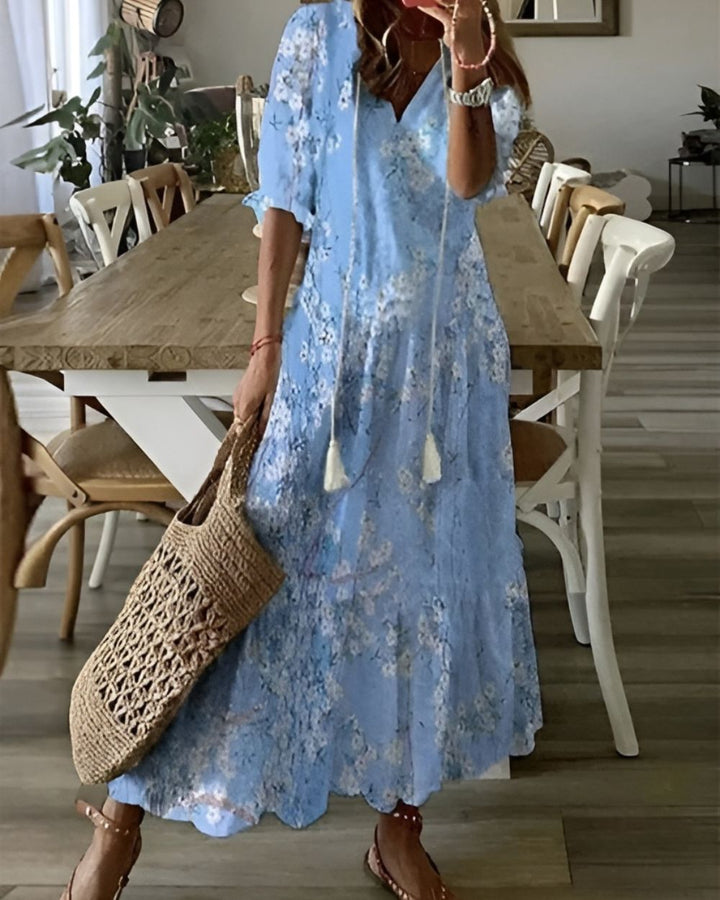 Flowy women's summer dress: bohemian printed v-neck maxi dress, perfect for casual outings or beach days.