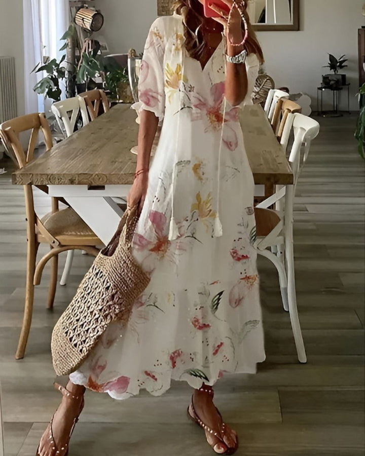 Bohemian women's maxi dress with a beautiful print and v-neck, versatile for summer, beach, or casual wear.