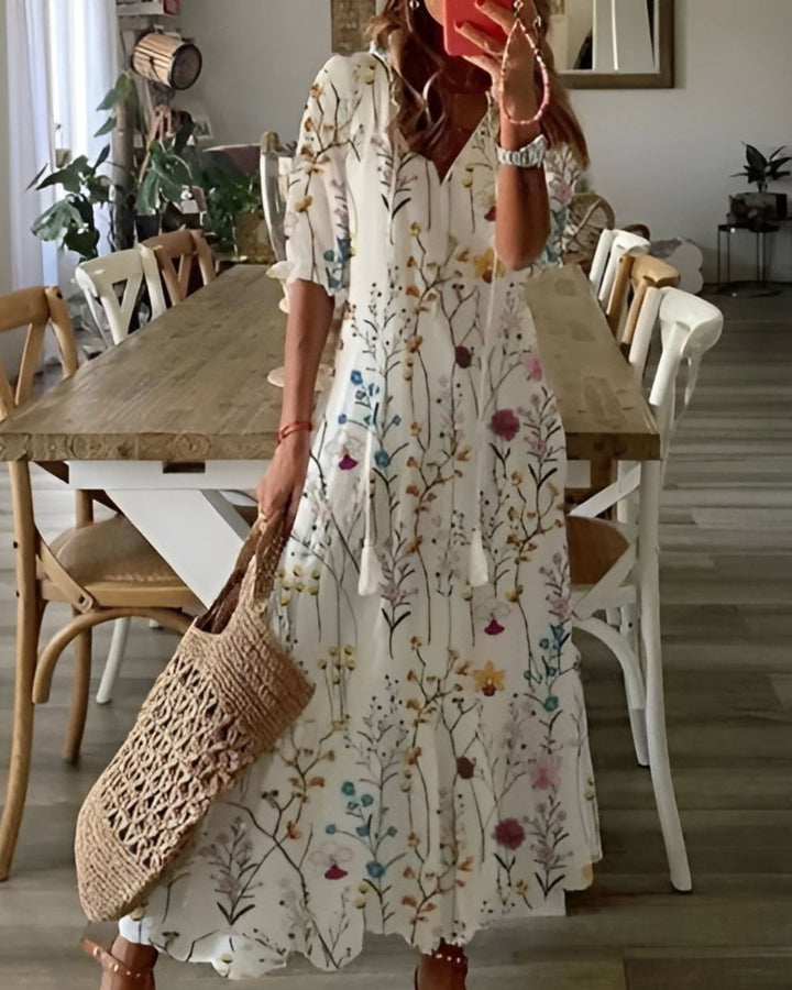 Vibrant printed v-neck maxi dress for women, showcasing a flowy boho design, essential for summer fashion.
