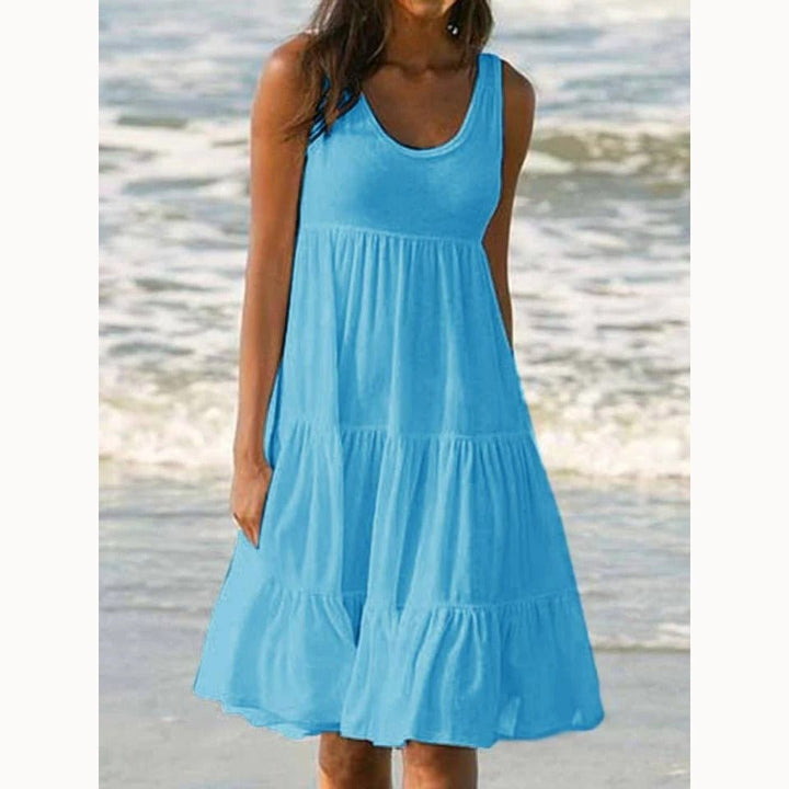 Elegant comfort women's sleeveless tiered midi dress. Boho style with a scoop neck, ruffle hem, perfect for summer.