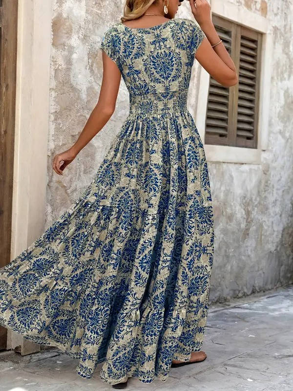 Chic smocked tiered maxi dress for women, bohemian style with V-neck & cap sleeves, ensuring effortless comfort.