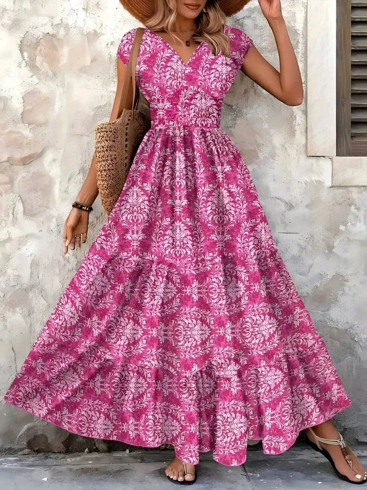 Effortless bohemian smocked tiered maxi dress for women. A comfortable V-neck summer casual outfit.