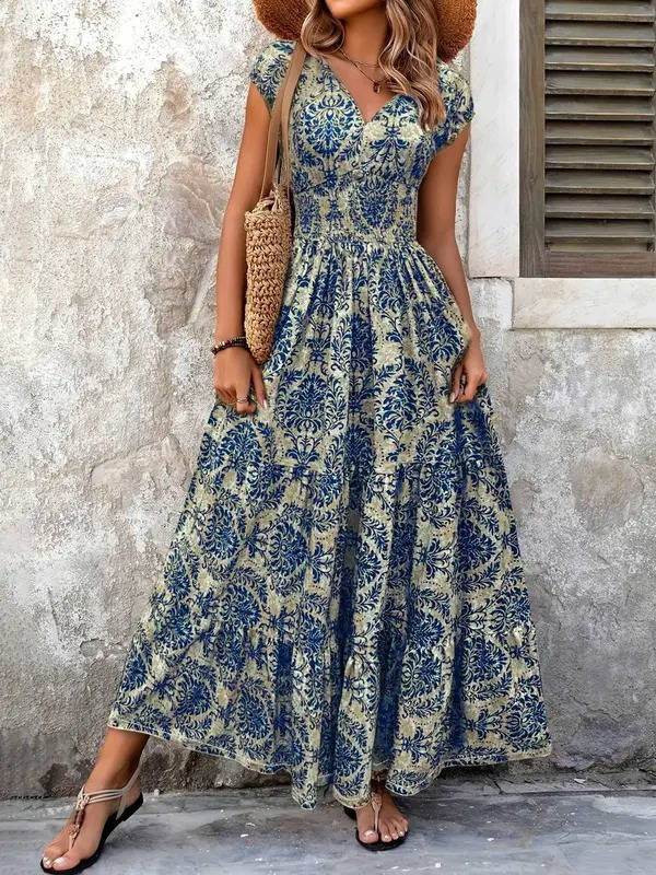 Lightweight women's boho smocked tiered maxi dress, V-neck, cap sleeves, perfect for summer holidays.
