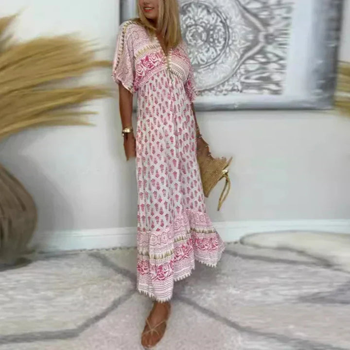 Effortless women's printed boho maxi dress with playful tassels & short sleeves for summer vacation.