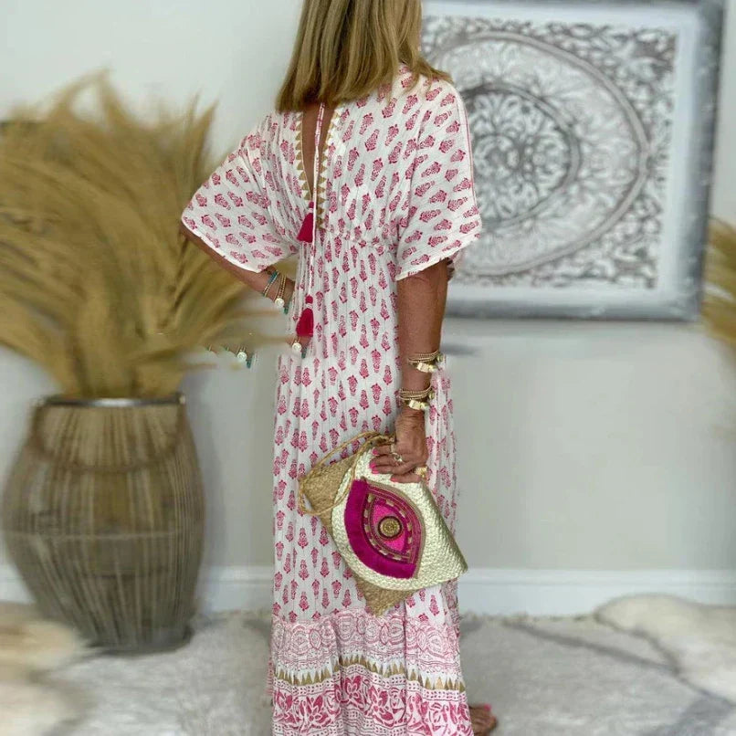 Casual women's short sleeve boho maxi dress with tassels and a vibrant print, ideal for summer holidays.