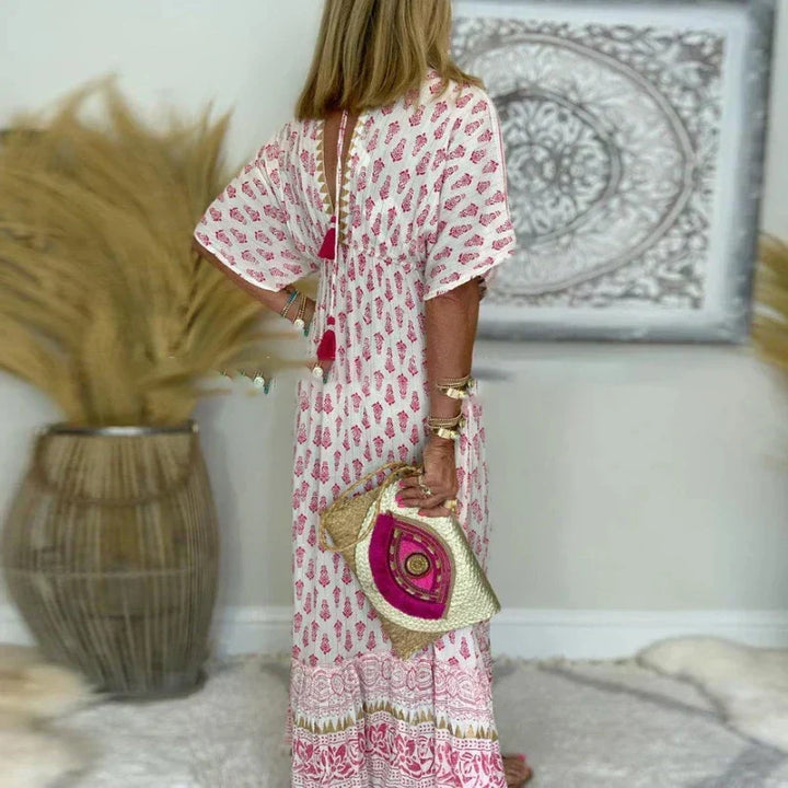 Casual women's short sleeve boho maxi dress with tassels and a vibrant print, ideal for summer holidays.