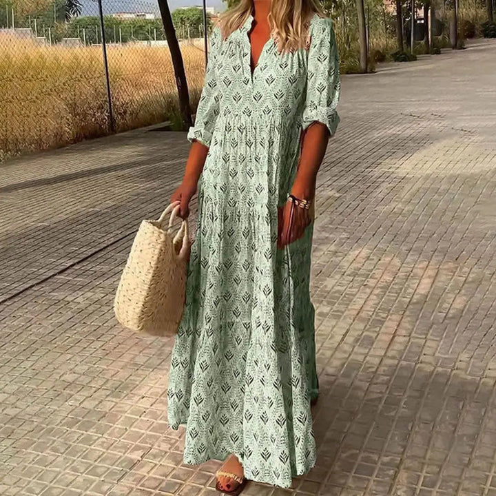 Casual V-neck maxi dress for women, featuring a bohemian print, long flowy design & adjustable roll-up sleeves.