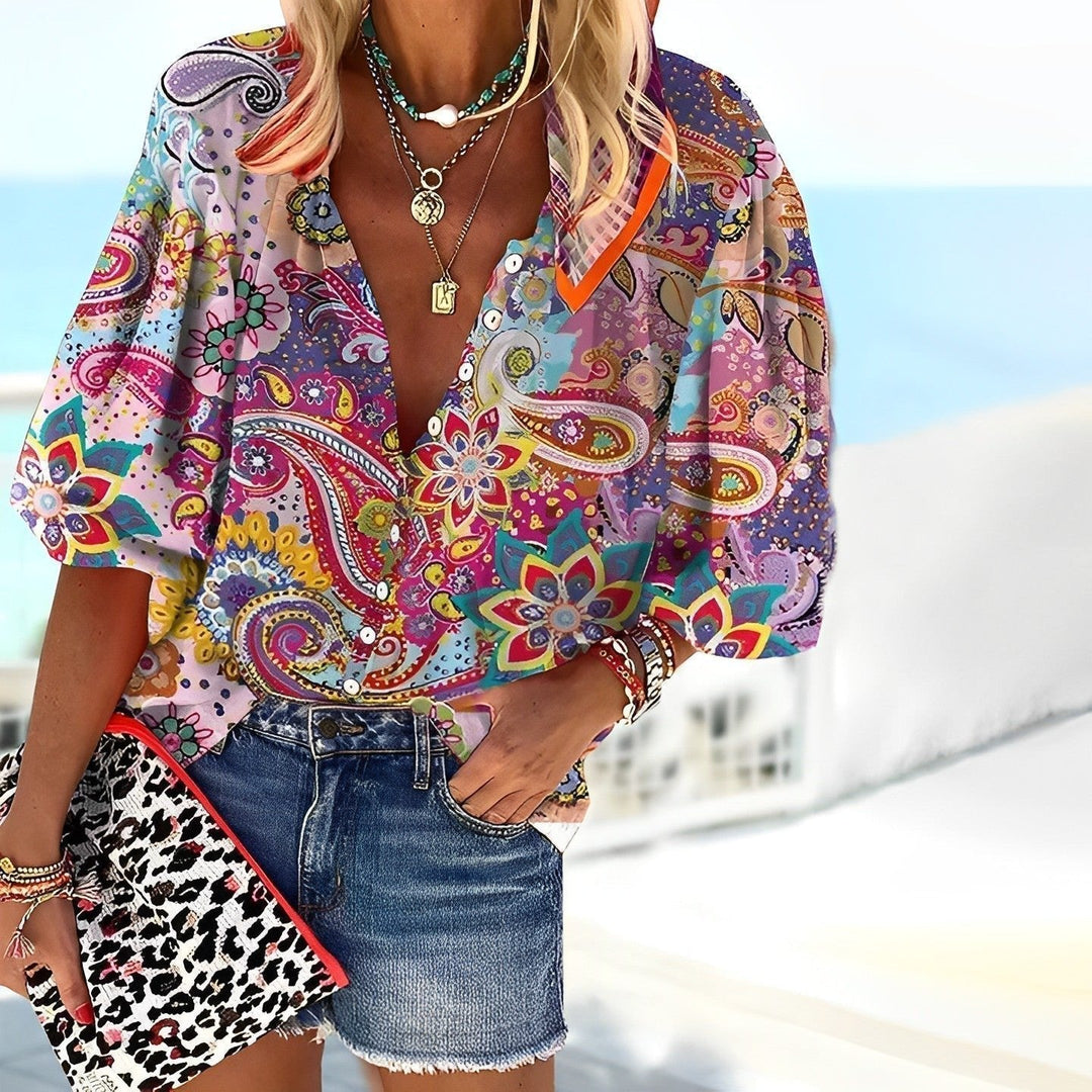 Women's boho V-neck paisley print blouse with three-quarter sleeves. Multicolor, relaxed fit for summer casual chic.