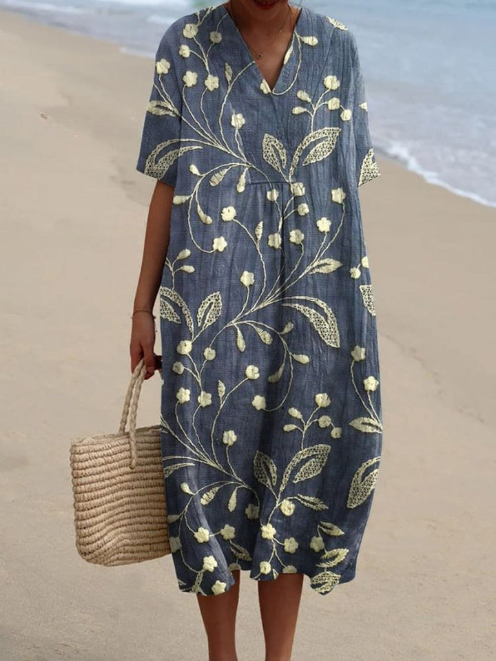 Striped V-neck midi dress for women. Relaxed fit, short sleeve Boho style for comfortable warm weather fashion.