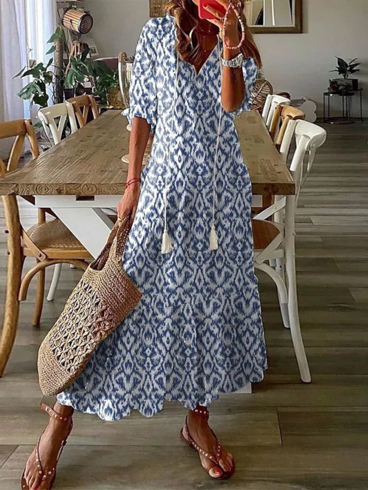 Women's boho V-neck summer dress with vibrant floral pattern. Perfect for casual wear & vacation.