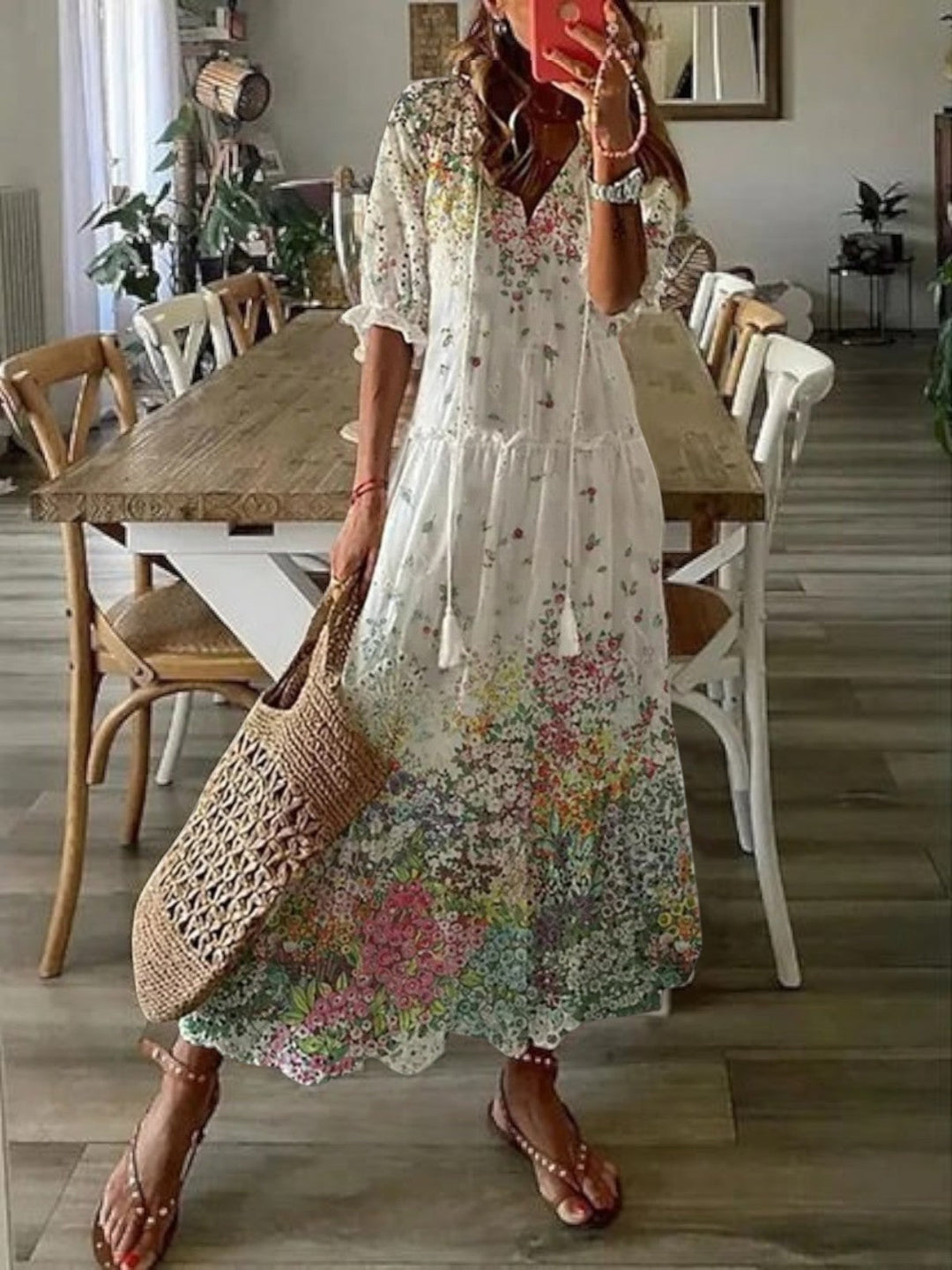 Charming women's boho V-neck summer dress with a relaxed fit. Beautiful floral pattern for effortless style.