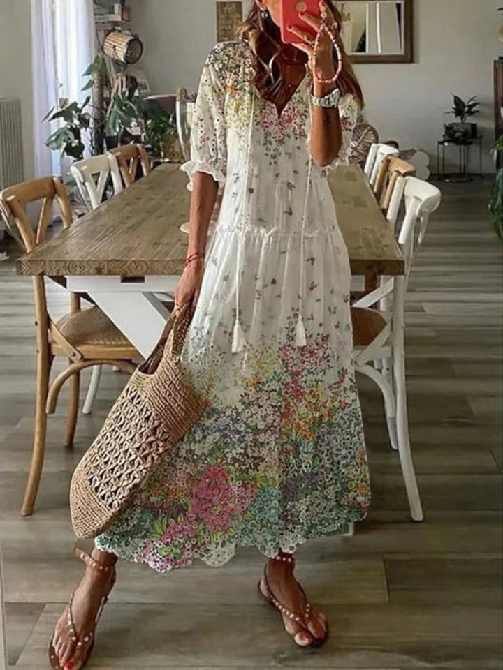 Charming women's boho V-neck summer dress with a relaxed fit. Beautiful floral pattern for effortless style.