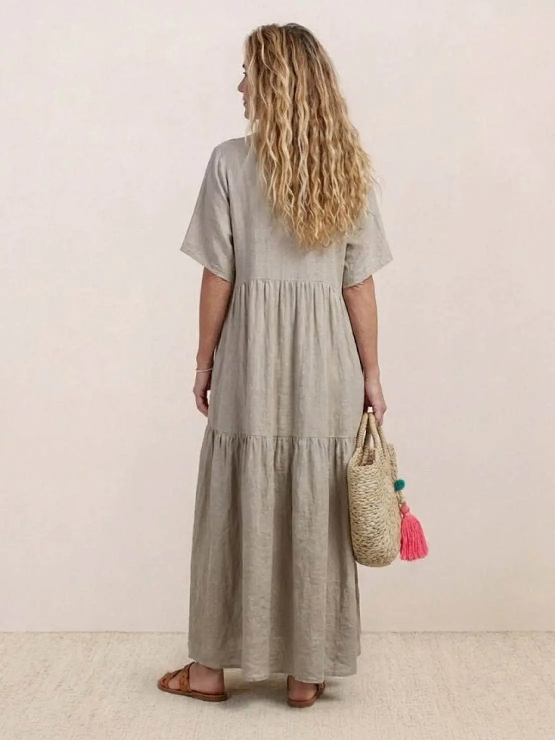 Women's V-neck short sleeve swing dress, tiered maxi, comfortable bohemian style.