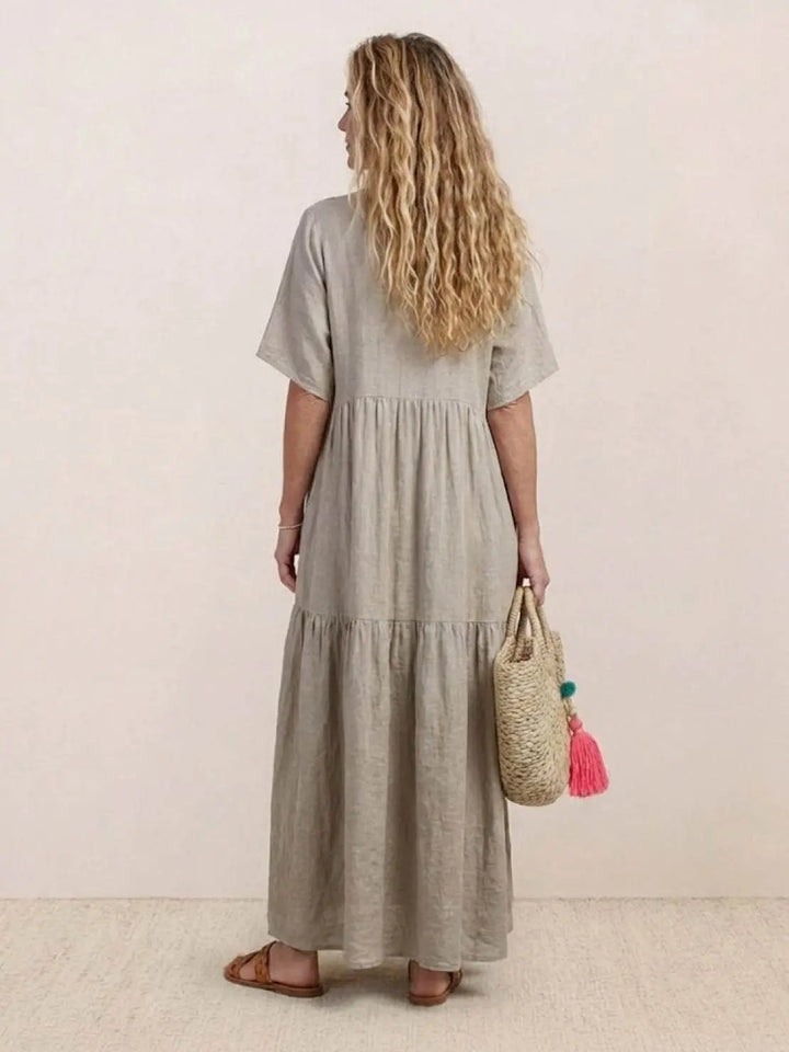 Women's V-neck short sleeve swing dress, tiered maxi, comfortable bohemian style.