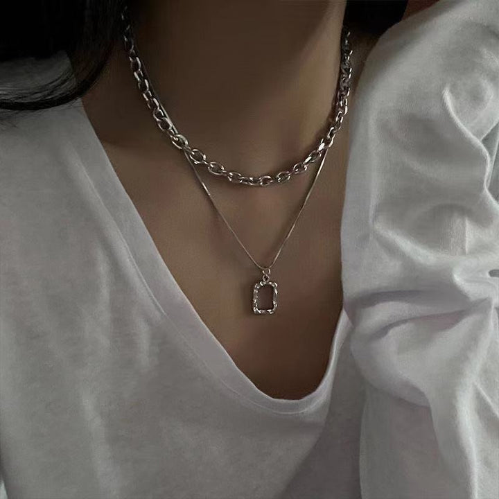Trendy gold chunky chain necklace for women, featuring a stylish unique rectangular pendant. Fashion accessory, gift for her.
