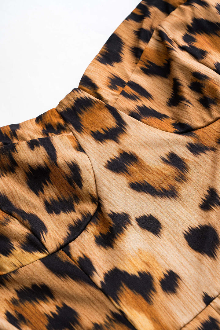 Statement women's leopard print midi dress with a fitted corset, a chic and bold look for parties.