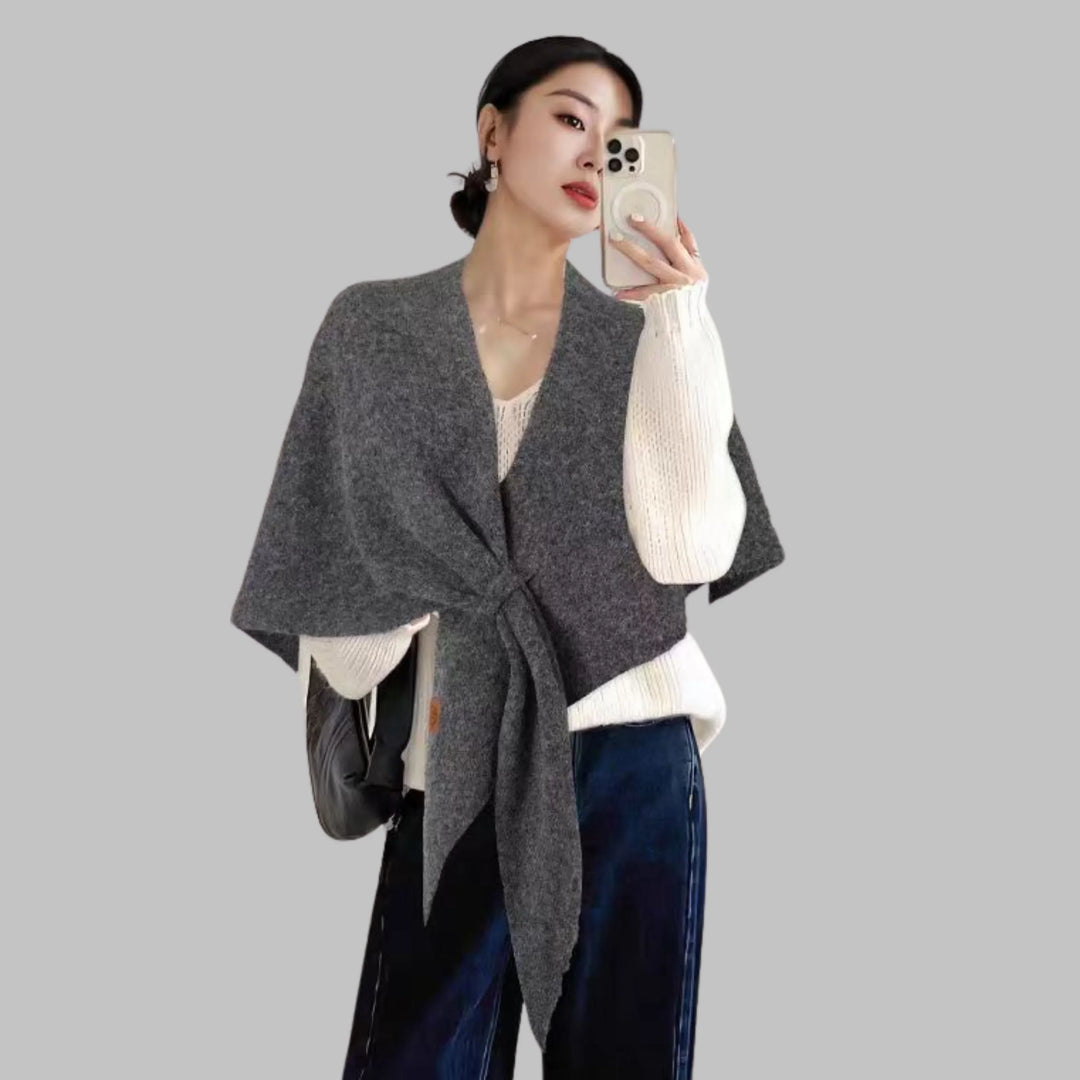 Stylish women's bold striped triangle wrap. Soft, cozy fashion accessory ideal for elegant layering.
