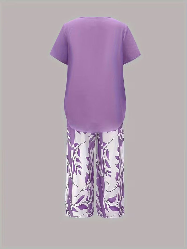 Stylish women's botanical print two-piece matching set, perfect for a chic summer look.