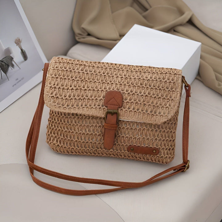 Women's braided straw shoulder bag with adjustable strap. Ideal for summer beach trips & holidays.