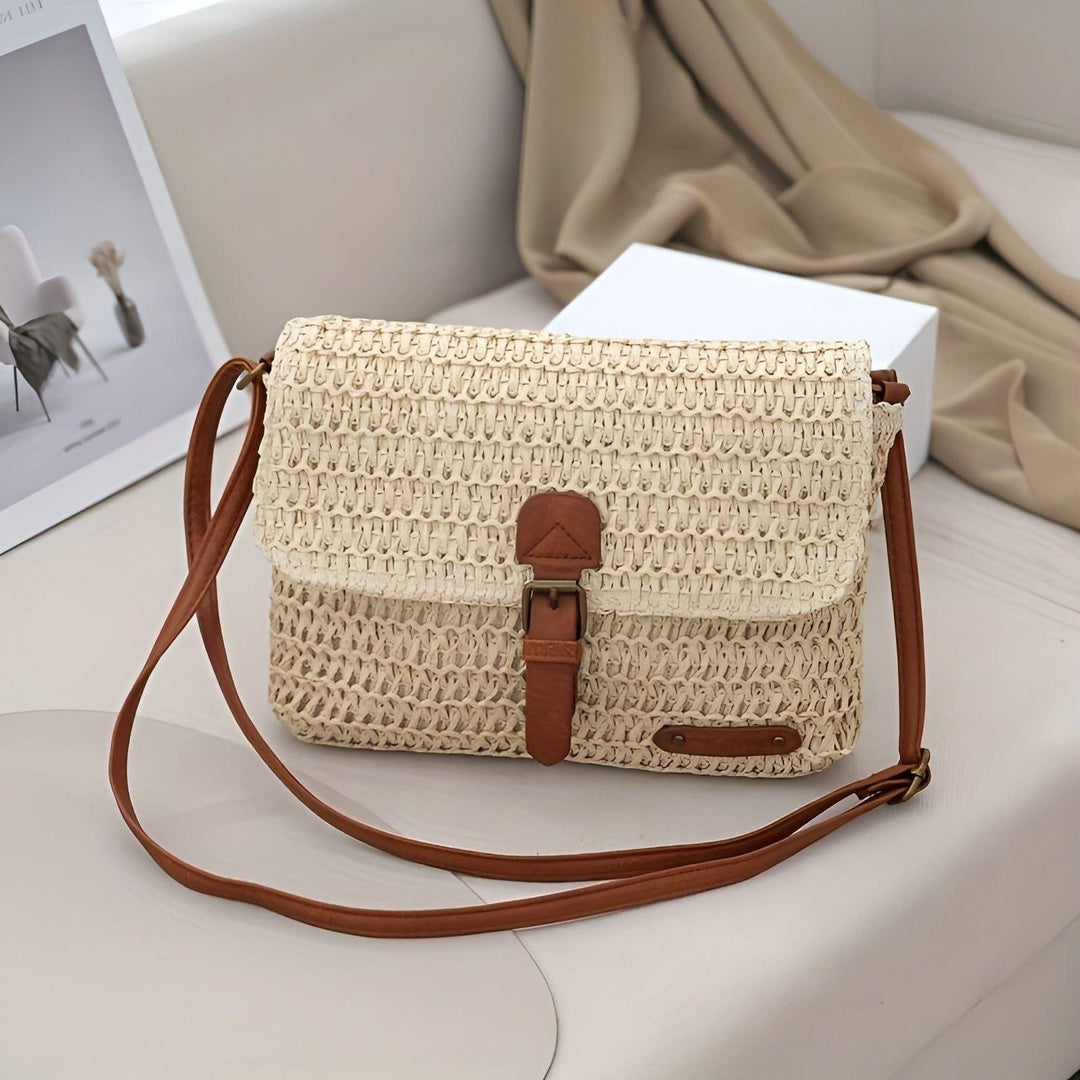 Chic braided straw summer shoulder bag with adjustable strap. Perfect for women's boho & casual looks.