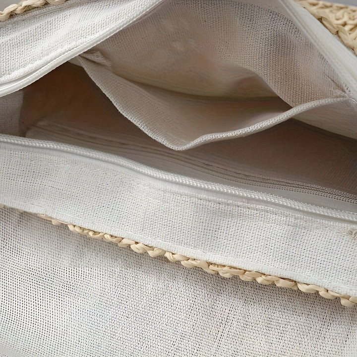 Lightweight women's braided straw shoulder bag. Adjustable strap for comfortable, versatile everyday wear.