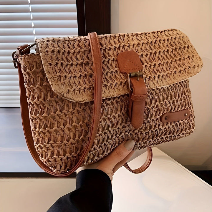 Stylish women's braided straw shoulder bag. Adjustable strap for versatile beach, holiday, & casual wear.