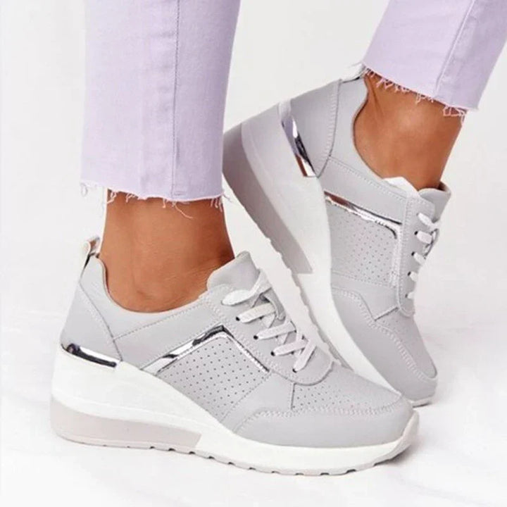 Woman wearing stylish everyday breathable sneakers, perfect for activewear, walking, and comfortable casual support.