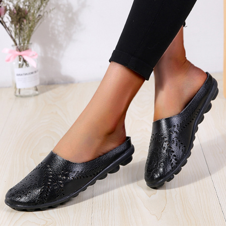 Close-up of women's breathable slippers, showcasing lightweight material & comfortable design for ladies footwear.
