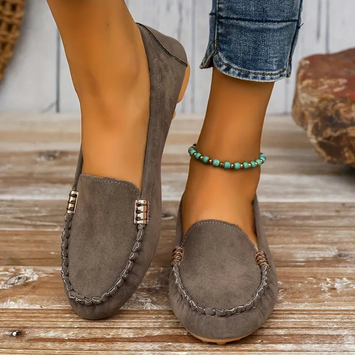 Close-up of comfortable women's slip-on flats, showcasing breathable fabric and lightweight design.