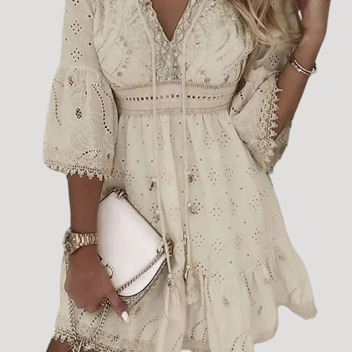 Stylish women's embroidered mini dress. Boho summer fashion, great for casual wear or as a beach cover-up.