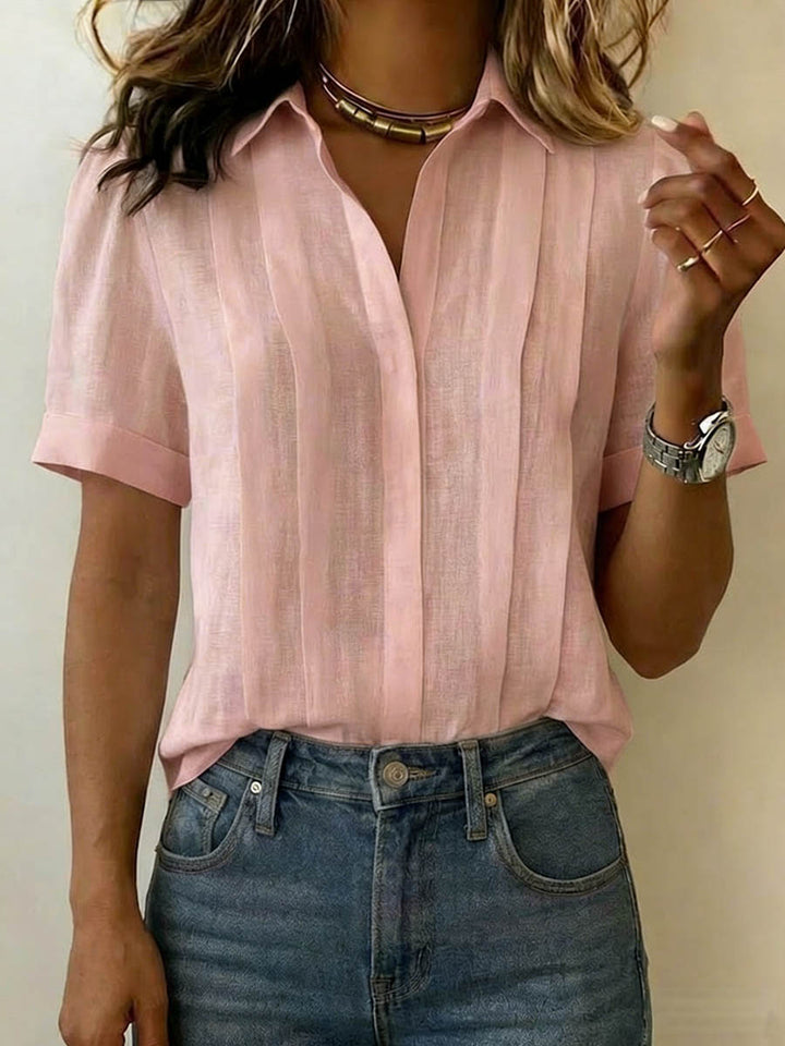 Casual yet chic women's breezy short-sleeve top. Ideal summer fashion blouse for everyday comfort.