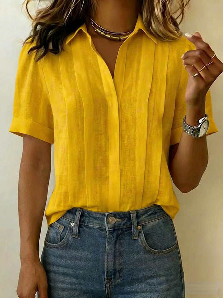 Versatile short-sleeve women's blouse. Effortless style for work, casual outings, or summer days.