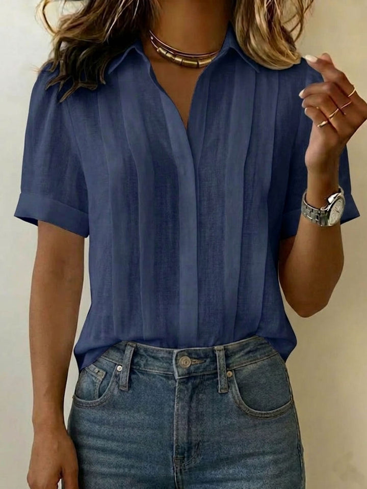 Soft & breezy women's short-sleeve blouse. An elegant collared top perfect for everyday wear.