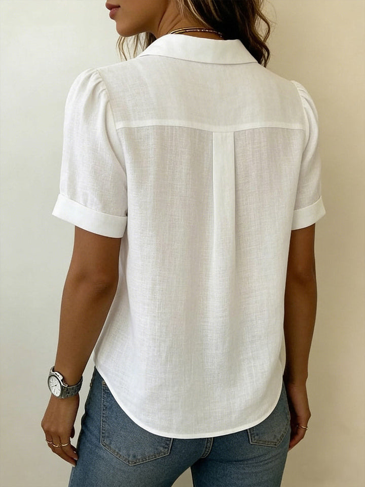 Stylish women's short-sleeve blouse. Breezy & comfortable collared top for summer fashion & work.