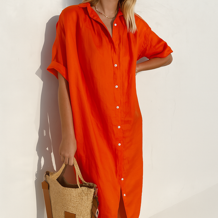 Chic women's button-down midi shirt dress with a relaxed fit, embodying versatile and elegant summer fashion.